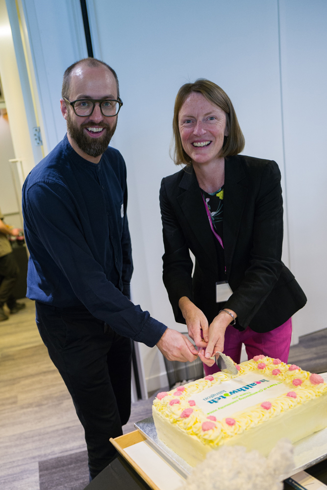 Healthwatch chair Ralph Hughes and chief executive Emma Whitby cutting the birthday cake. Photo: Penny Dampier