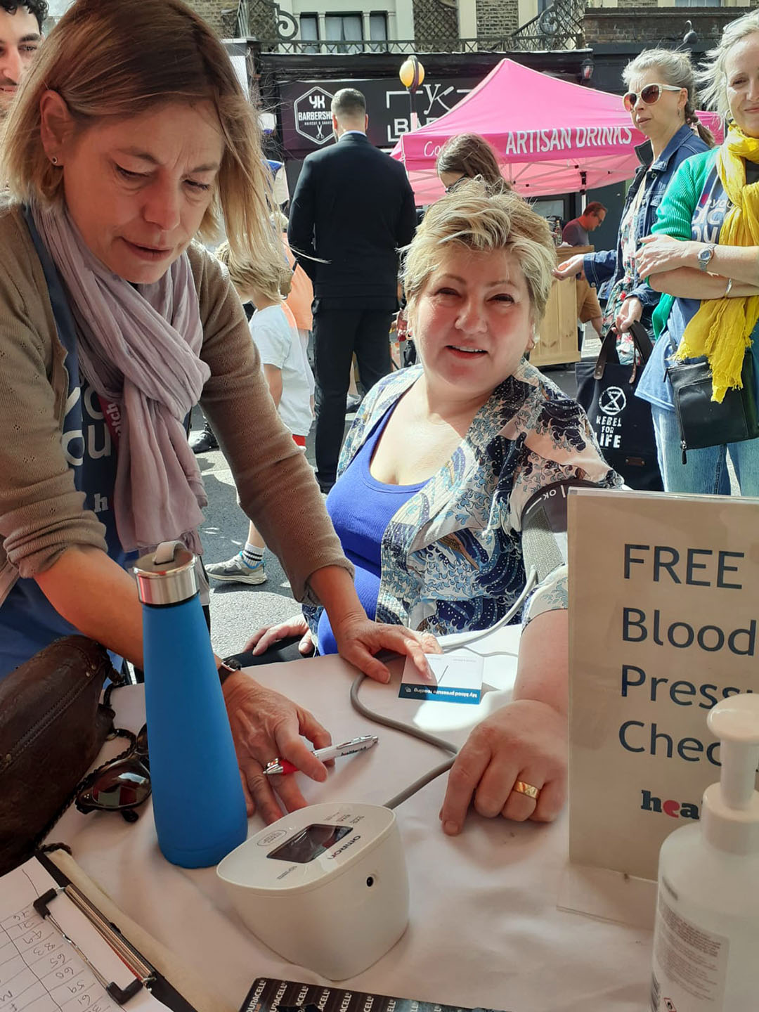 Healthwatch staff giving a blood pressure reading to Emily Thornberry at the Cally Festival in July 2023