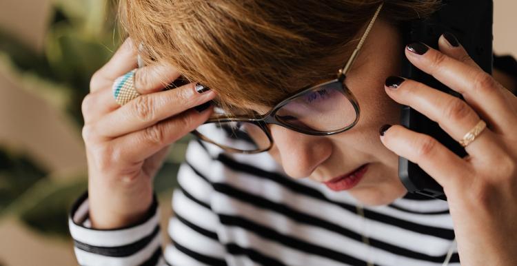 Anxious woman talking on the phone