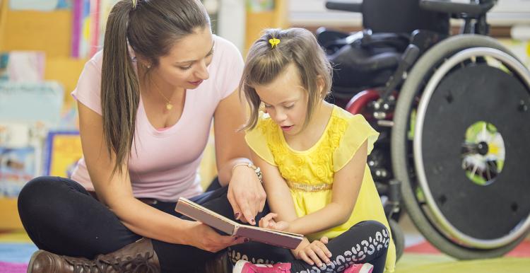 Young unpaid carer with disabled child