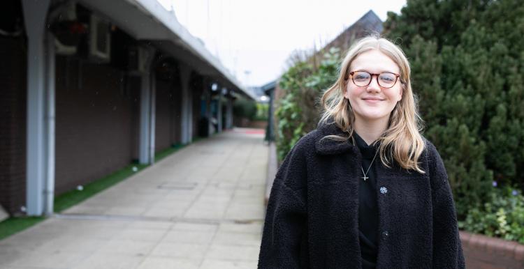 Young woman outside a building