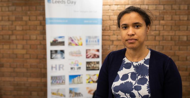 Woman at a stall offering support services