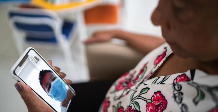 Patient talking to a doctor using mobile phone