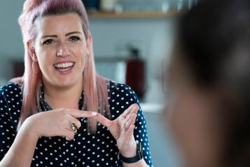 Two women having conversation using sign language