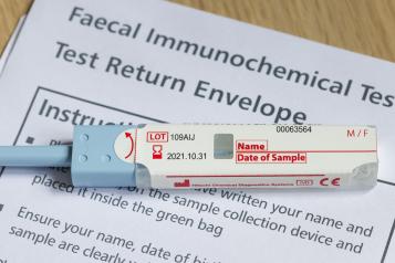 Closeup of FIT test (faecal immunochemical test), a fecal occult blood test for screening bowel cancer